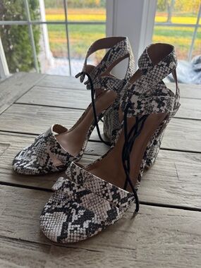 Gianni Bini snakeskin sandals featuring a block heel and ankle strap